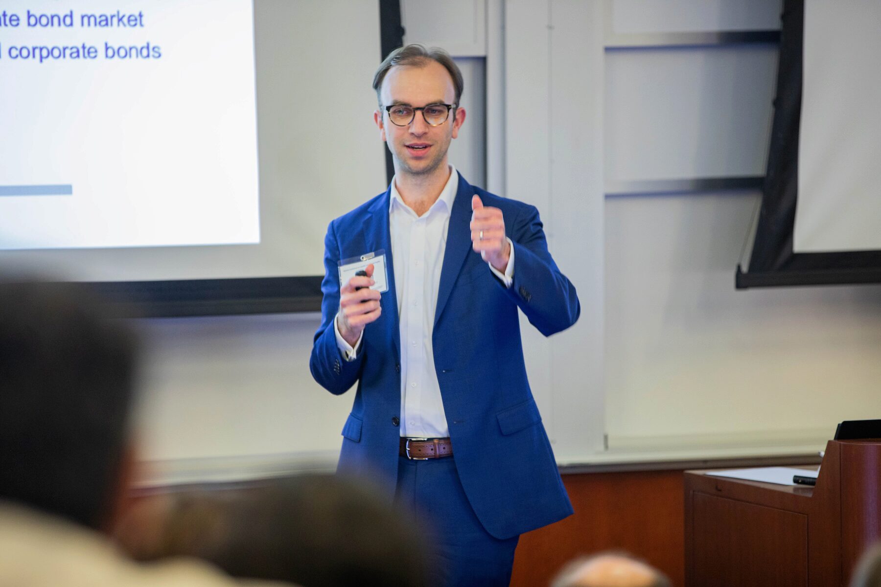 A person addresses an audience during a presentation